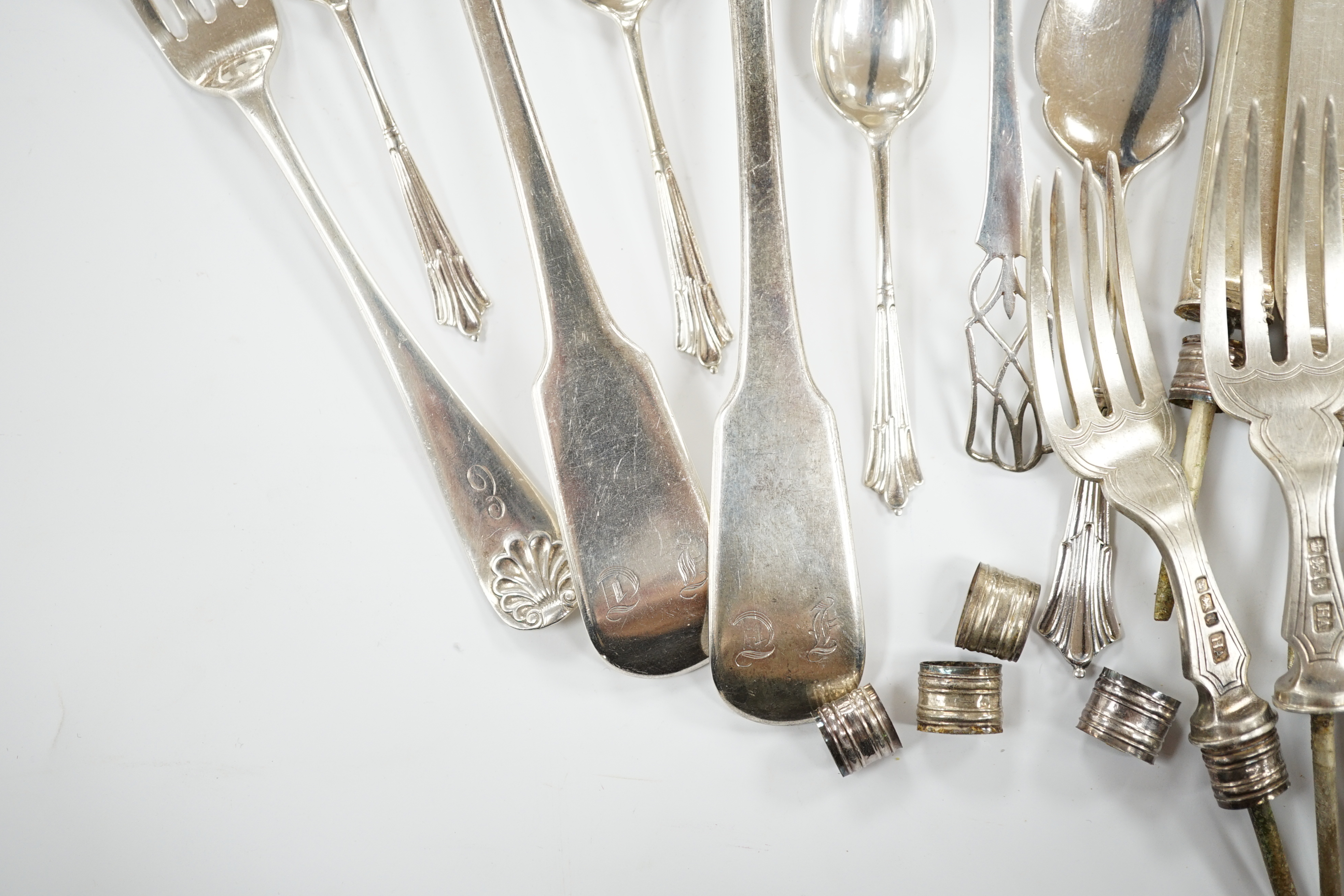A pair of George IV silver fiddle pattern table spoons, William Bateman, London, 1824, six other later silver items of flatware, 7.5oz, together with six silver knife blades and five set of silver fork tines, gross 11.8o